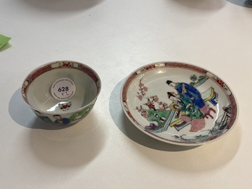 A Chinese famille rose cup and saucer with a couple on a terrace, Qianlong