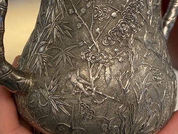 A Chinese silver teapot with birds among blossoming branches, 19th C.