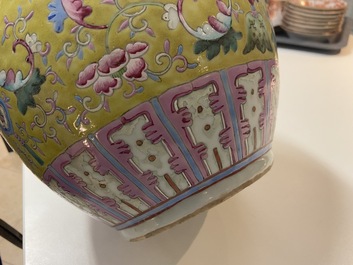 A Chinese yellow-ground famille rose bottle vase, 19th C.