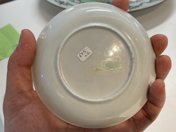 A Chinese famille rose cup and saucer with a couple on a terrace, Qianlong