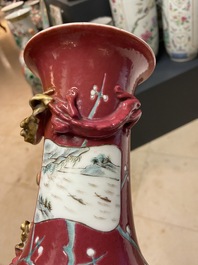 A pair of Chinese famille rose ruby-ground vases, 19th C.