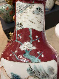 A pair of Chinese famille rose ruby-ground vases, 19th C.