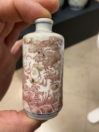 Five Chinese blue, white and copper-red snuff bottles, 18/20th C.