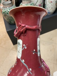 A pair of Chinese famille rose ruby-ground vases, 19th C.