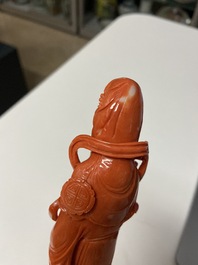 A Chinese carved red coral 'Guanyin' figure, 19/20th C.