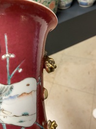 A pair of Chinese famille rose ruby-ground vases, 19th C.