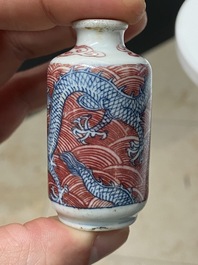 Five Chinese blue, white and copper-red snuff bottles, 18/20th C.