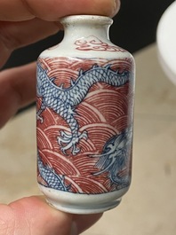 Five Chinese blue, white and copper-red snuff bottles, 18/20th C.