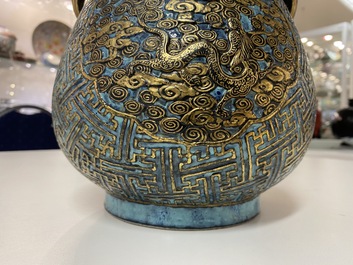 A Chinese 'robin's egg and imitation bronze'-glazed 'hu' vase, Qianlong mark, 19th C.