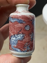 Five Chinese blue, white and copper-red snuff bottles, 18/20th C.