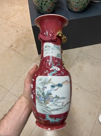 A pair of Chinese famille rose ruby-ground vases, 19th C.