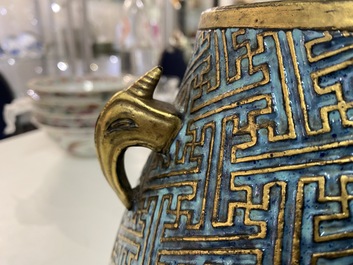 A Chinese 'robin's egg and imitation bronze'-glazed 'hu' vase, Qianlong mark, 19th C.