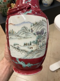 A pair of Chinese famille rose ruby-ground vases, 19th C.
