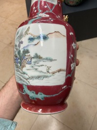 A pair of Chinese famille rose ruby-ground vases, 19th C.