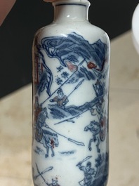 Five Chinese blue, white and copper-red snuff bottles, 18/20th C.