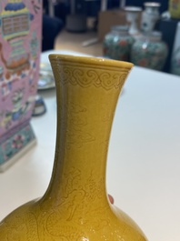 A Chinese monochrome yellow-glazed bottle vase with incised dragon design, Daoguang mark, 19/20th C.