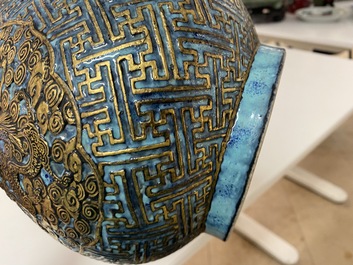 A Chinese 'robin's egg and imitation bronze'-glazed 'hu' vase, Qianlong mark, 19th C.