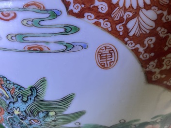 A Chinese famille verte 'mythical animals' vase and a famille rose jar and cover with dragons, 19/20th C.
