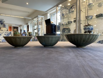 Three Chinese celadon-glazed 'lotus' bowls, Song
