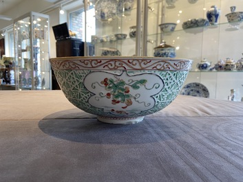 A Chinese famille verte relief-decorated bowl with squirrels and rabbits, Kangxi