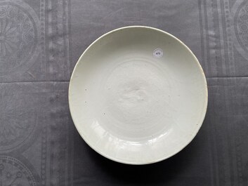 A Chinese monochrome white dish with incised double phoenix design, Jiajing mark, Ming