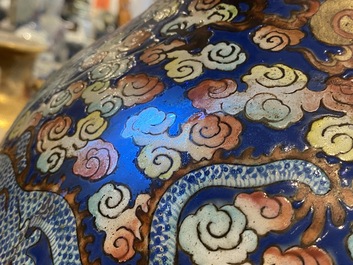 A pair of large Chinese famille rose 'dragon' vases, 19th C.