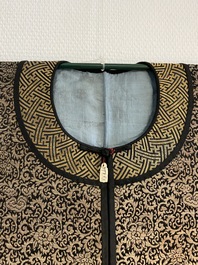 A Chinese embroidered silk woman's robe with floral scrolls, 19th C.