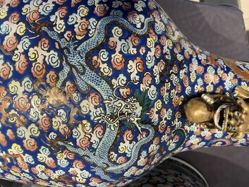 A pair of large Chinese famille rose 'dragon' vases, 19th C.
