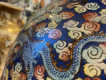 A pair of large Chinese famille rose 'dragon' vases, 19th C.