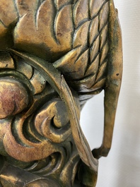 A large Chinese gilded wooden 'dragon' stand, 19th C.