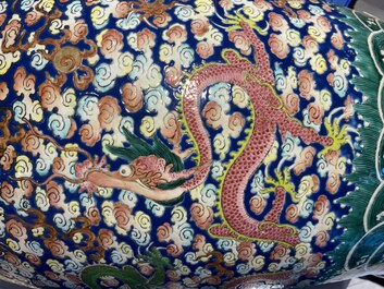 A pair of large Chinese famille rose 'dragon' vases, 19th C.