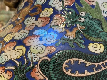 A pair of large Chinese famille rose 'dragon' vases, 19th C.