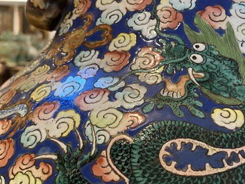A pair of large Chinese famille rose 'dragon' vases, 19th C.