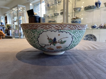 A Chinese famille verte relief-decorated bowl with squirrels and rabbits, Kangxi