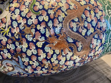 A pair of large Chinese famille rose 'dragon' vases, 19th C.