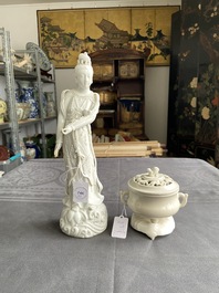 A Chinese Dehua blanc de Chine figure of Guanyin and a covered censer on stand, 18/19th C.