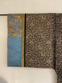 A Chinese embroidered silk woman's robe with floral scrolls, 19th C.