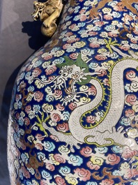 A pair of large Chinese famille rose 'dragon' vases, 19th C.