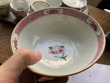 A varied collection of Chinese famille rose and grisaille cups and saucers and a 'rooster' bowl, Yongzheng/Qianlong