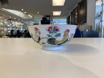 A varied collection of Chinese famille rose and grisaille cups and saucers and a 'rooster' bowl, Yongzheng/Qianlong
