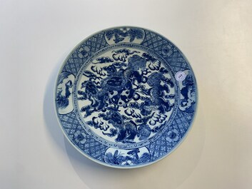 Three Chinese blue and white dishes with dragons, phoenixes and Buddhist lions, 19th C.