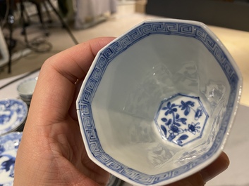 Twenty-one Chinese blue and white saucers and eighteen cups, Kangxi
