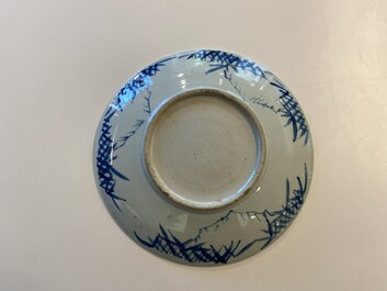 Three Chinese blue and white dishes with dragons, phoenixes and Buddhist lions, 19th C.