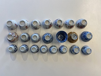 Twenty-two Chinese blue and white and famille rose cups and nineteen saucers, Kangxi and later