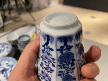 Twenty-one Chinese blue and white saucers and eighteen cups, Kangxi