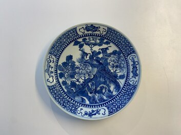 Three Chinese blue and white dishes with dragons, phoenixes and Buddhist lions, 19th C.