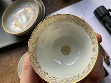 A varied collection of Chinese famille rose and grisaille cups and saucers and a 'rooster' bowl, Yongzheng/Qianlong