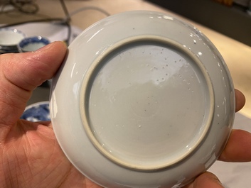 Twenty-one Chinese blue and white saucers and eighteen cups, Kangxi