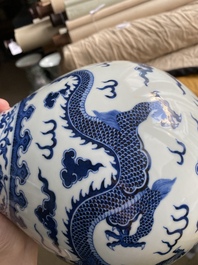 A Chinese blue and white 'yuhuchunping' 'dragon' vase on wooden stand, Qianlong mark, 19/20th C.