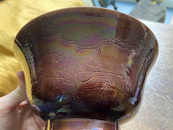 A Chinese aubergine-glazed bowl with incised design of cranes, Kangxi